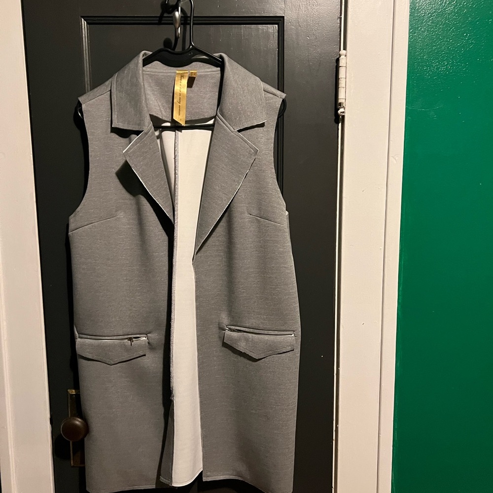 Gray sleeveless vest by There is a Star in Every Woman.